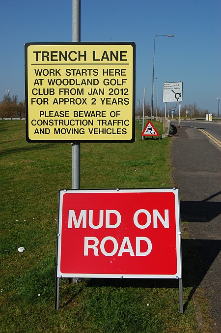 Signs warning of "mud on road" on Trench Lane, Bradley Stoke