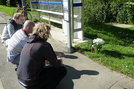 Friends pay their respects at the scene of the accident.