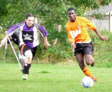 Shad Esimeng (right) on the ball for Bradley Stoke Town FC.