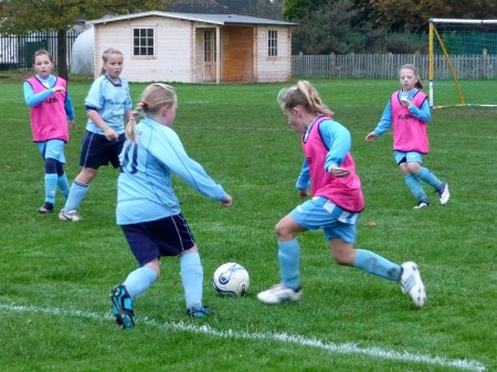 Bradley Stoke Youth FC's U10 Girls in action against AEK Boco Blue.