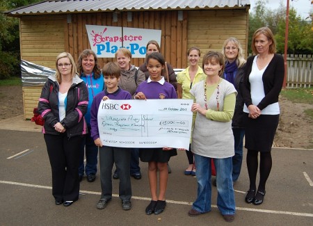 Members of the school's Friends Group hand over a cheque for £15,000.