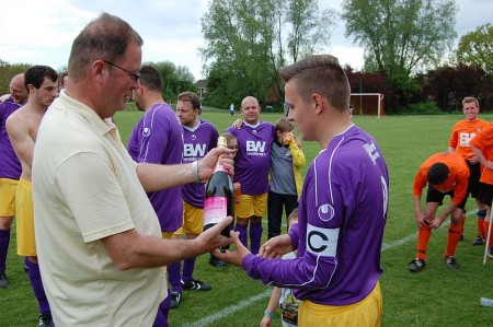 BSTFC Chairman Ian Drew congratulates the All Stars' captain.