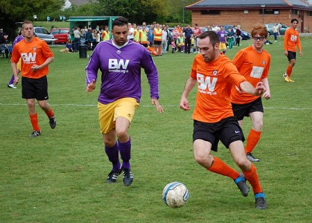 BSTFC defenders close down an All Stars' attack.