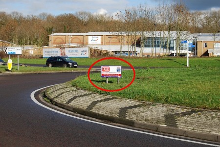 Advertising sign on the Savages Wood Roundabout.