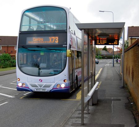 A First West of England X73 bus at the Linden Drive stop in Bradley Stoke, Bristol.