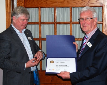 Peter Randall of Bradley Stoke Rotary Club (right) receives the Paul Harris Award from club president Phil King.