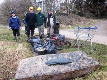 Conservation group members with rubbish cleared from the brook.