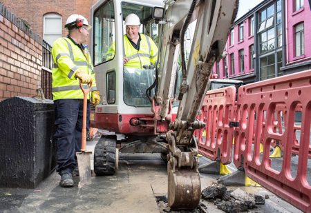 Mini-excavators digging trenches in pavements, which could soon become a familiar sight in Bradley Stoke.