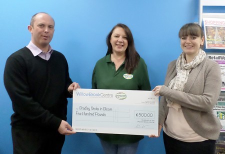 Representatives of the Willow Brook Centre present a cheque for £500 to Sara Messenger (centre) of Bradley Stoke in Bloom.