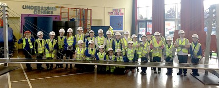 Staff from Alun Griffiths (Contractors) Ltd present the 'Bridge to Schools' project at Little Stoke Primary School.