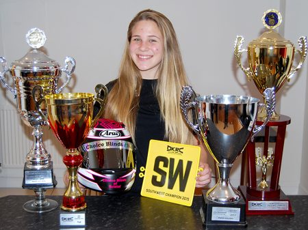 Paige Holden with some of her many karting trophies.