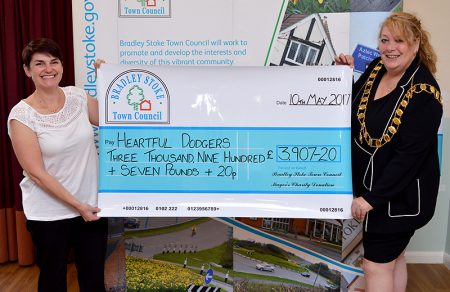 Photo of Cllr Elaine Hardwick presenting a mayor's charity cheque to Louise Hill of Heartful Dodgers.