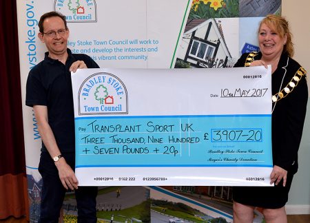 Photo of Cllr Elaine Hardwick presenting a mayor's charity cheque to Andrew Eddy of Transplant Sport.