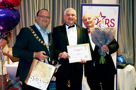 Photo of Martin Lee receiving his award.