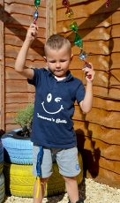 Photo of Cameron in the new sensory garden at his home.