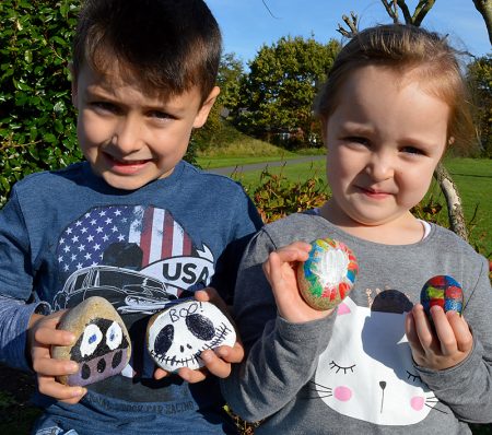 Charlie & Immy Wheeler show off some of the "rocks" they have decorated.