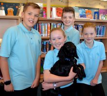 Photo of Year 7 students with Wally the Dog.