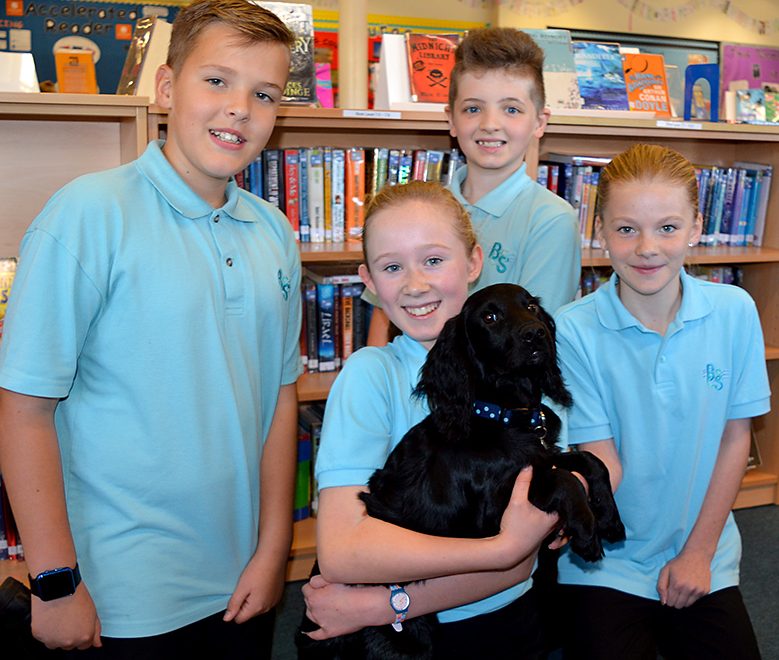 Photo of Year 7 students with Wally the Dog.