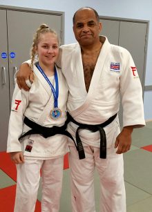 Photo of Tatum Keen, wearing her Croatia Cadet Cup silver medal, with coach Pete Douglas.