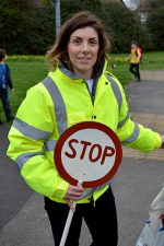 Photo of Esther Huke, dressed as a lollipop lady.