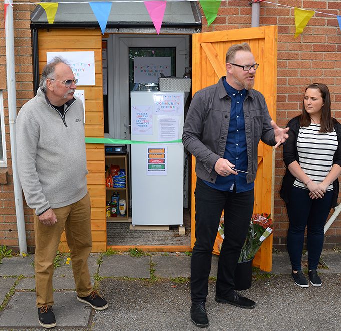 Photo of the official opening of the community fridge at Cafe Church.