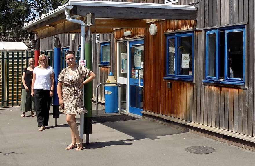 Photo of staff standing outside the front of Brght Sparks Pre-School in Stoke Lodge.