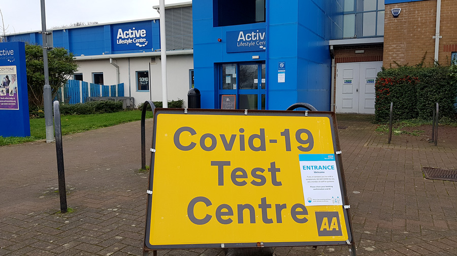 Photo of a yellow 'test centre' sign outside the leisure centre.