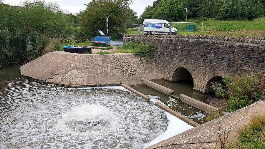 Photo of a water aerator operating in a lake.