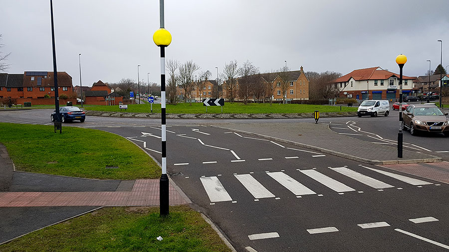 Photo of a roundabout and zebra crossing.