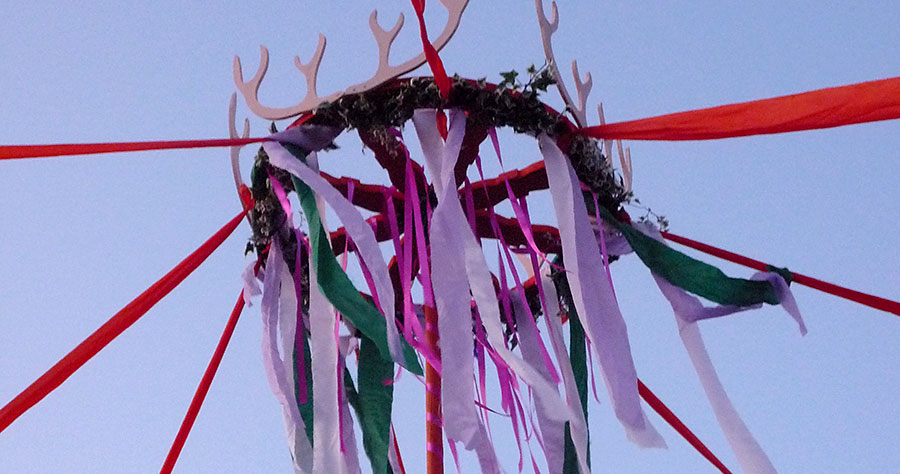 Photo of the top of a maypole.