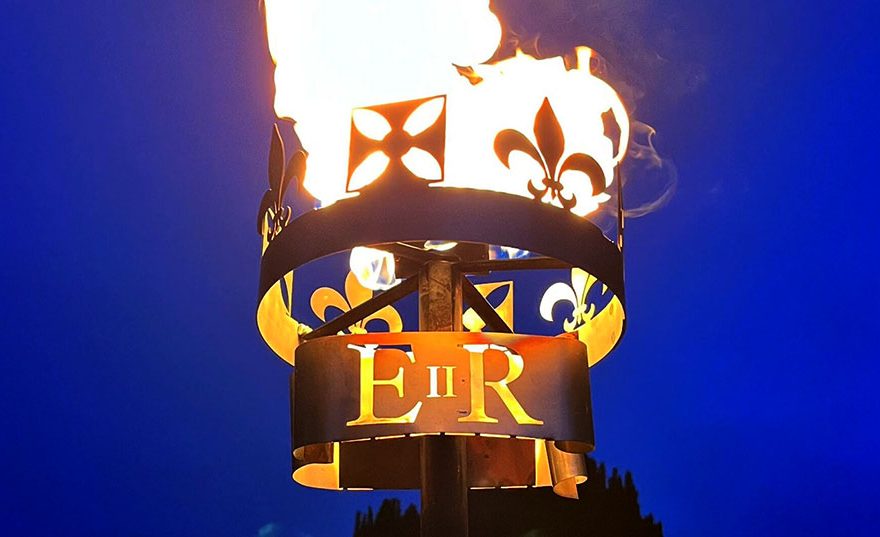 Photo of a burning beacon labelled 'EIIR'.