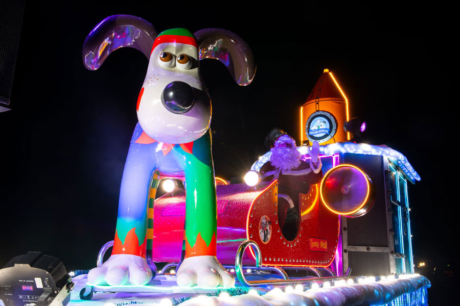 Photo of a dog sculpture on a Santa float..