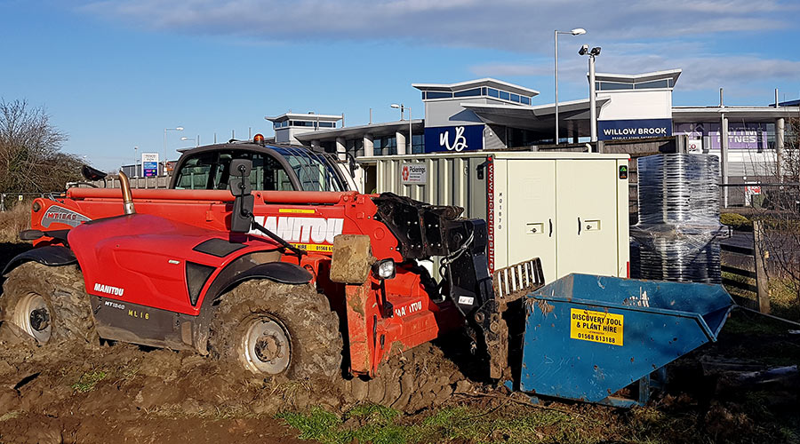 Photo of an excavator on a building site.