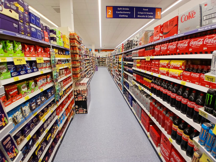 Photo of an aisle within a supermarket.