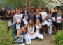 Photo of a group of students holding envelopes.