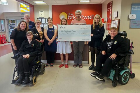 Photo of a charity cheque presentation.